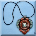 J24. Sterling silver and stone inlay pendant. 